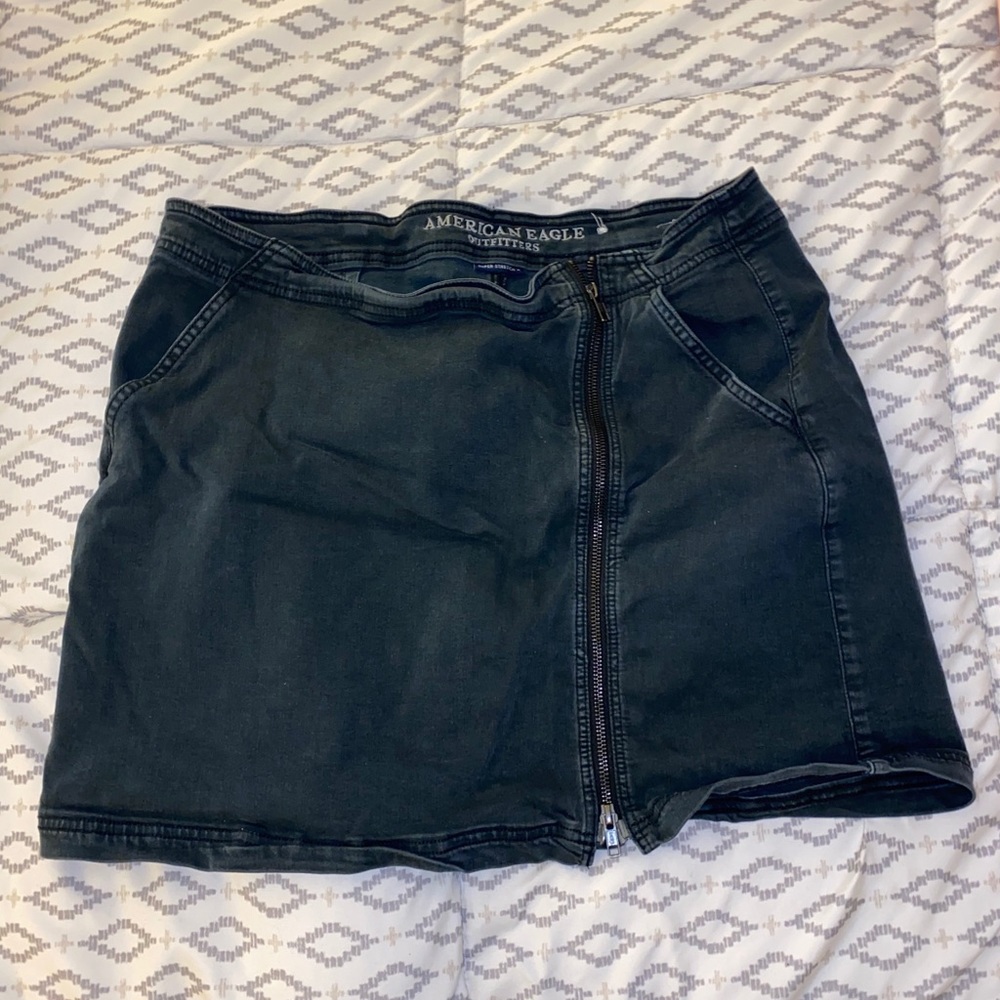 Side zip black skirt.